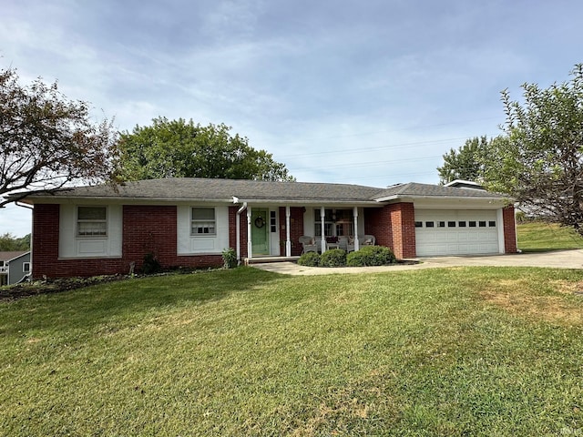 ranch-style house with covered porch, a garage, and a front lawn