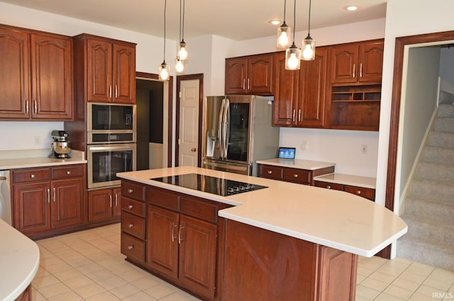 kitchen featuring black appliances, a kitchen island, decorative light fixtures, and light tile patterned floors