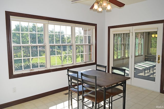 tiled dining room with ceiling fan