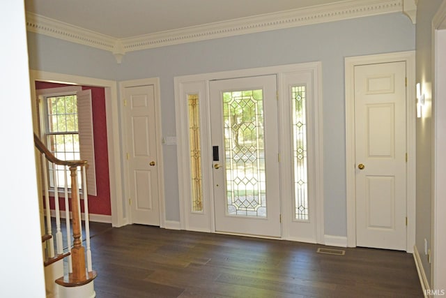 foyer entrance featuring dark hardwood / wood-style floors and ornamental molding