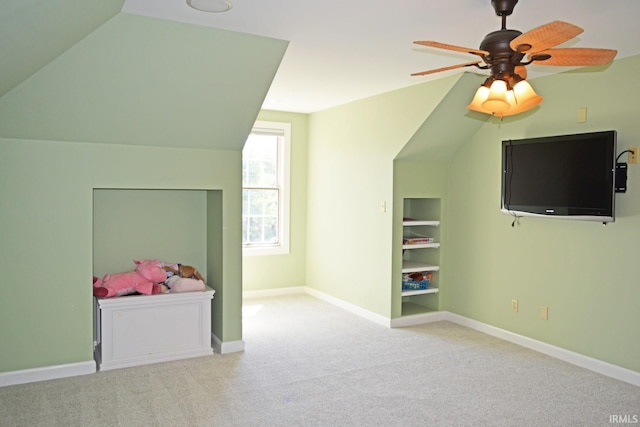 unfurnished bedroom with lofted ceiling and carpet