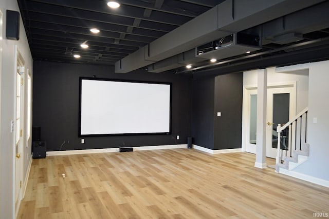 home theater room featuring light hardwood / wood-style floors