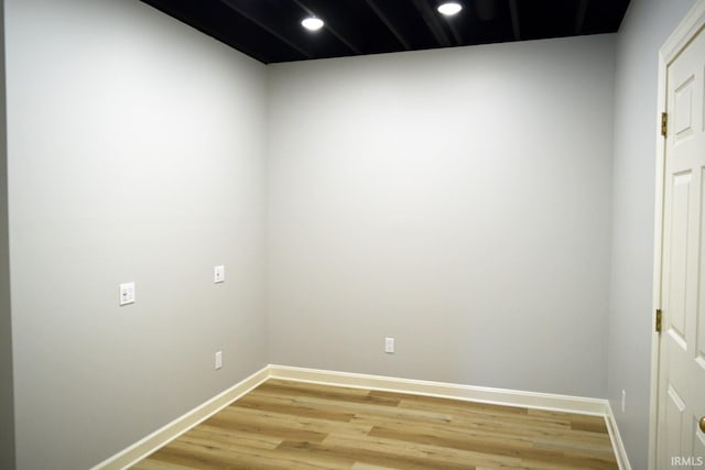 empty room with light hardwood / wood-style floors