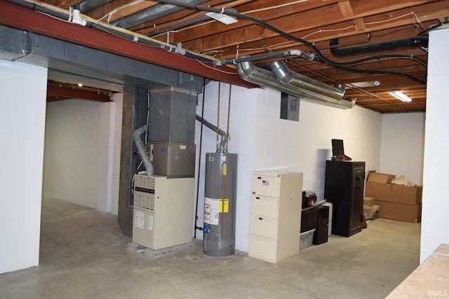 basement featuring gas water heater and heating unit