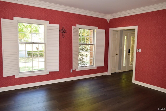 unfurnished room with a wealth of natural light, crown molding, and dark hardwood / wood-style floors