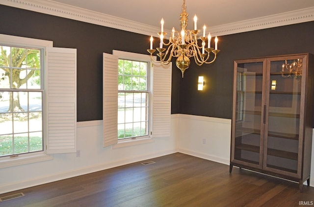 interior space with dark wood-type flooring, plenty of natural light, and an inviting chandelier