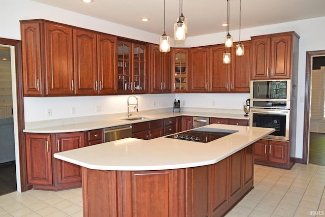 kitchen featuring a kitchen island, decorative light fixtures, black appliances, light tile patterned floors, and sink