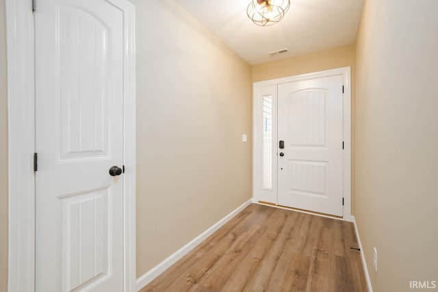 doorway to outside with light hardwood / wood-style flooring