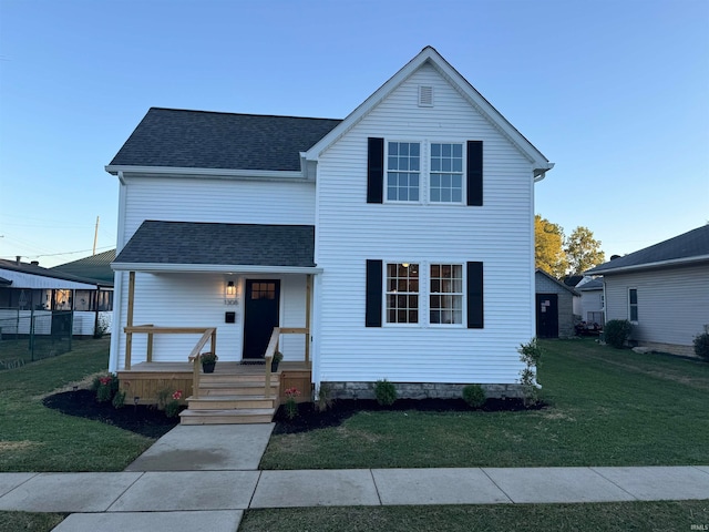 view of front of home with a front lawn