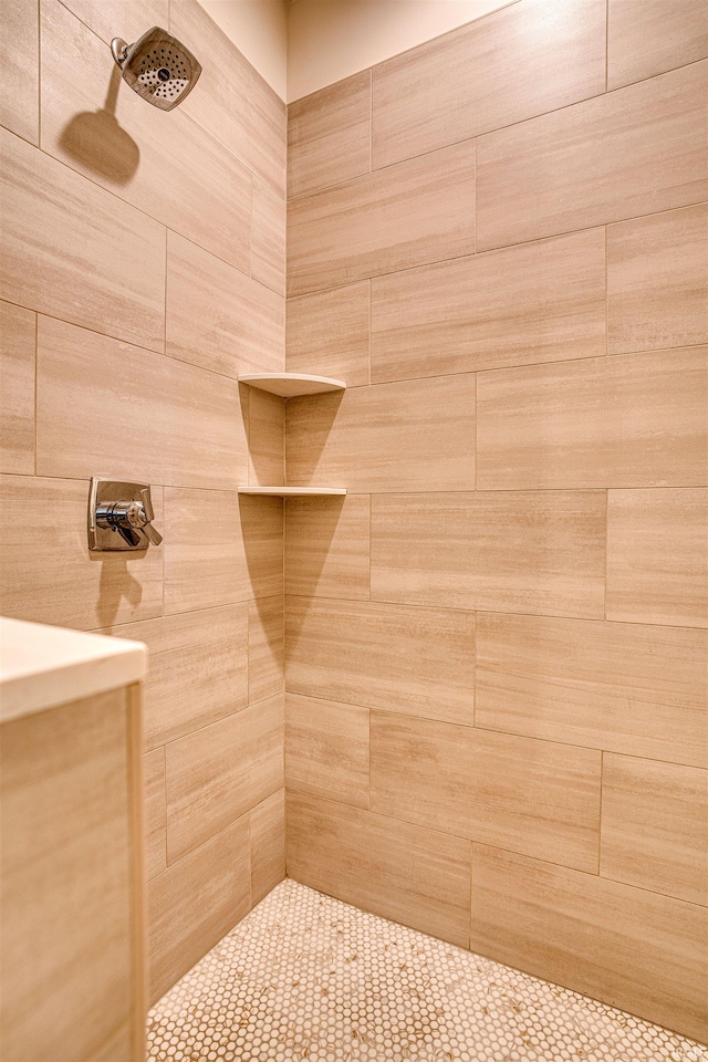 bathroom with tiled shower