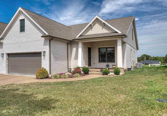 view of front of house with a porch, a front yard, and central AC unit