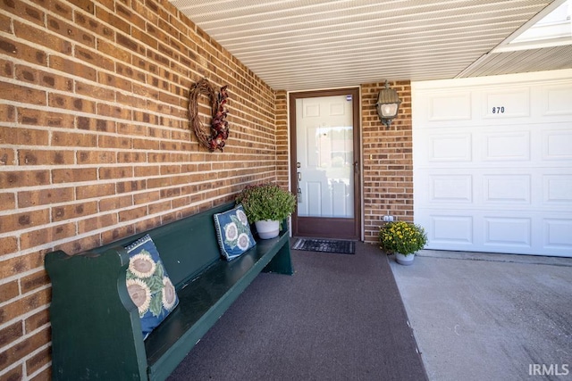 doorway to property with a garage