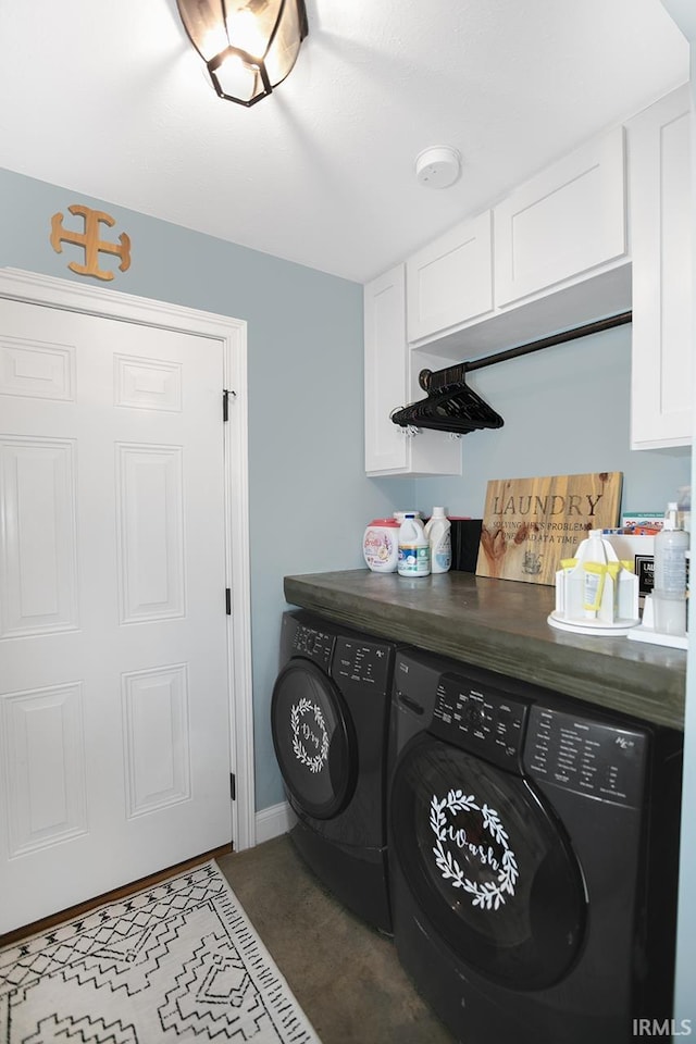 laundry area featuring cabinets and washing machine and dryer