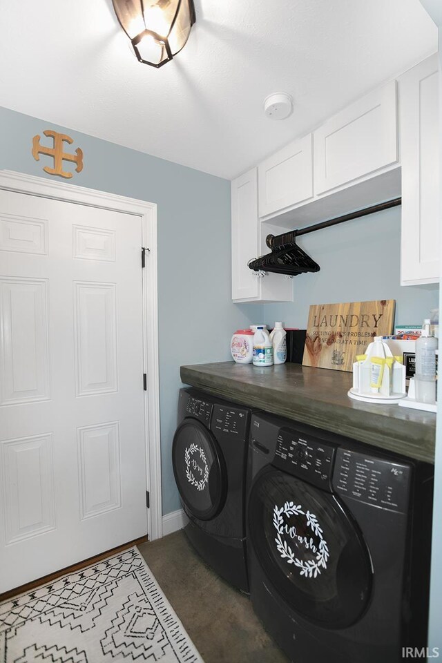16084 County Road 20, Goshen, IN 46528 - laundry area with baseboards, washing machine and dryer, and cabinet space