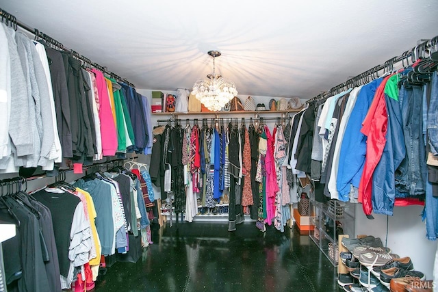 spacious closet with a chandelier