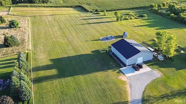 birds eye view of property with a rural view