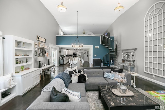 living room with high vaulted ceiling and an inviting chandelier