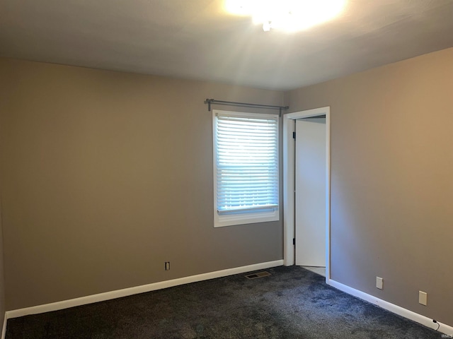 unfurnished room featuring carpet floors