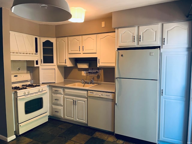 kitchen featuring white cabinets, white appliances, and sink