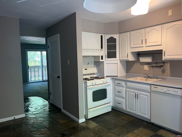 kitchen featuring white appliances, white cabinetry, and sink