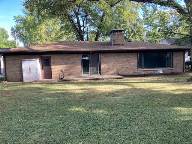 rear view of house with a lawn