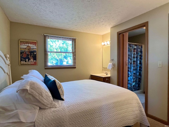 carpeted bedroom featuring a textured ceiling