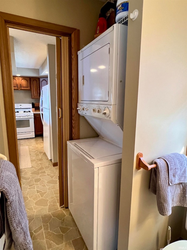 washroom featuring stacked washer and dryer