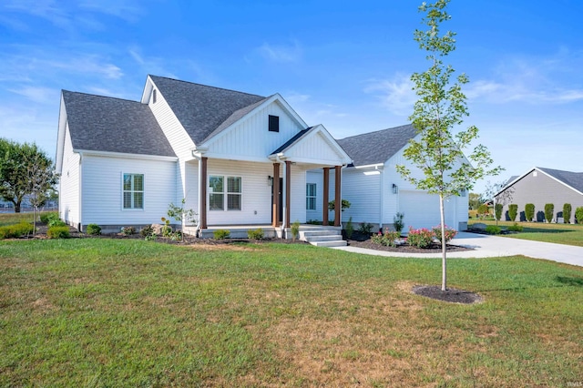 modern farmhouse featuring a porch, a garage, and a front yard