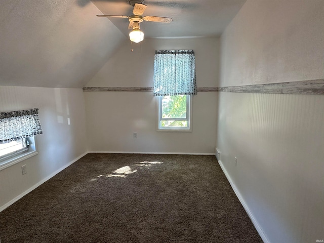 additional living space with ceiling fan, vaulted ceiling, and carpet