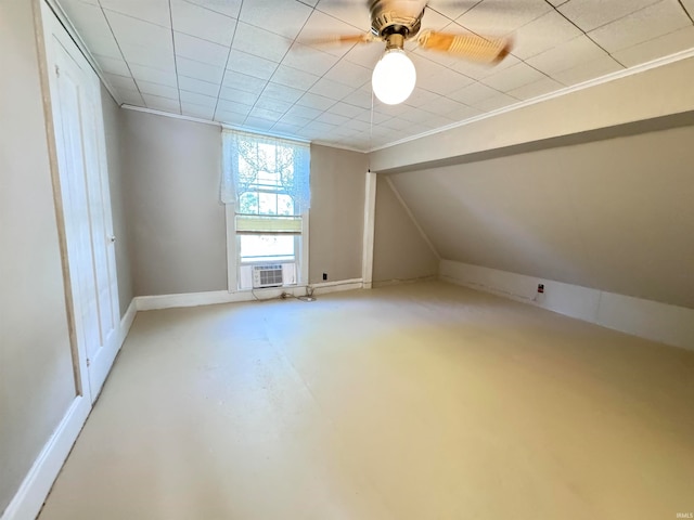 additional living space with concrete floors, ceiling fan, and cooling unit