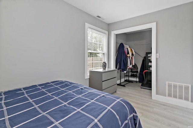 bedroom featuring light hardwood / wood-style flooring and a closet