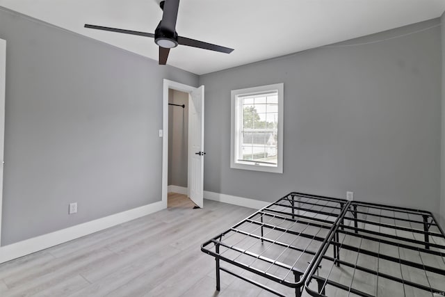 bedroom featuring ceiling fan and light hardwood / wood-style floors