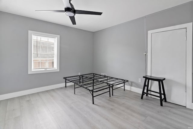 game room with ceiling fan and light hardwood / wood-style floors