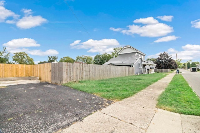 view of property exterior featuring a yard