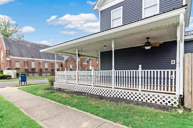 exterior space featuring ceiling fan, a lawn, and a porch