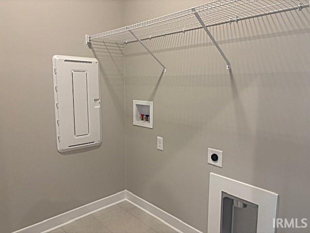 washroom with laundry area, hookup for a washing machine, baseboards, and electric dryer hookup