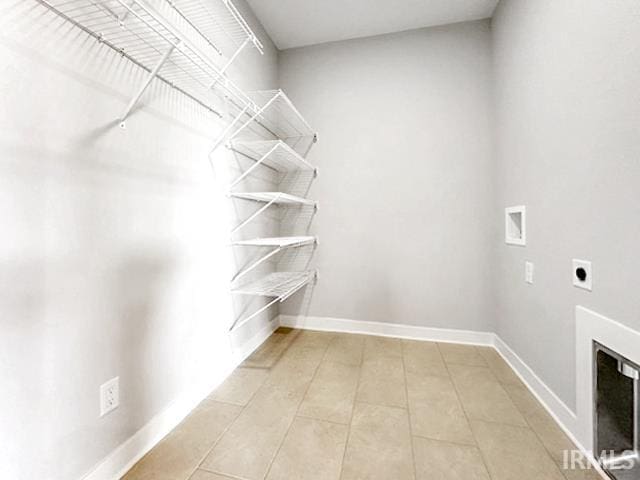 spacious closet featuring light tile patterned floors