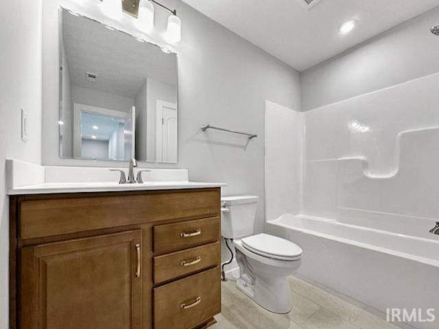 full bathroom with bathing tub / shower combination, vanity, and toilet