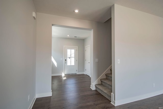 foyer entrance with dark wood-type flooring