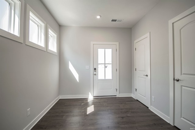 foyer with dark hardwood / wood-style floors