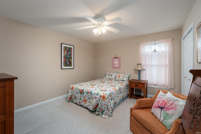 bedroom with a closet, ceiling fan, and carpet