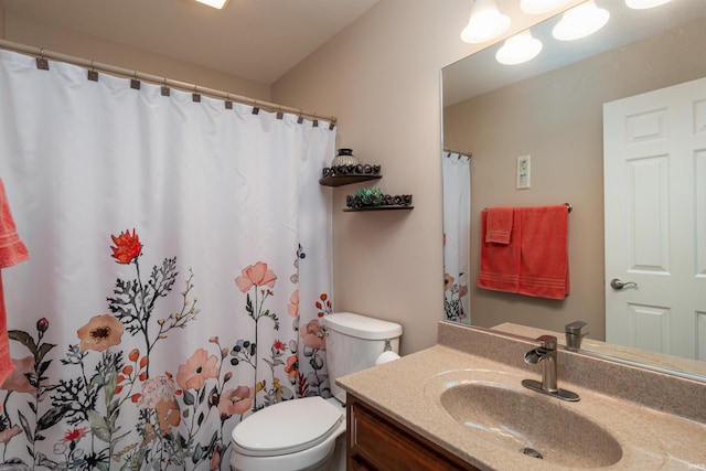 bathroom featuring vanity, toilet, and a shower with shower curtain