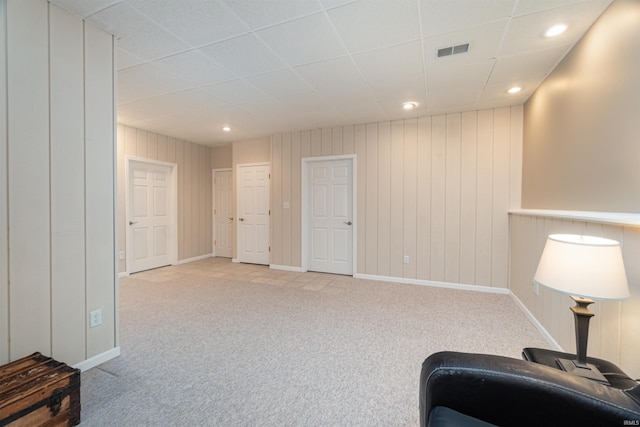 sitting room featuring light carpet