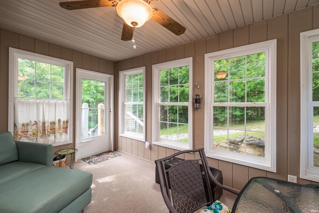 sunroom featuring ceiling fan