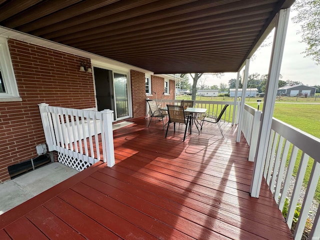 wooden deck with a yard