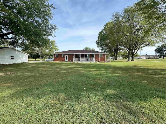 view of yard with covered porch