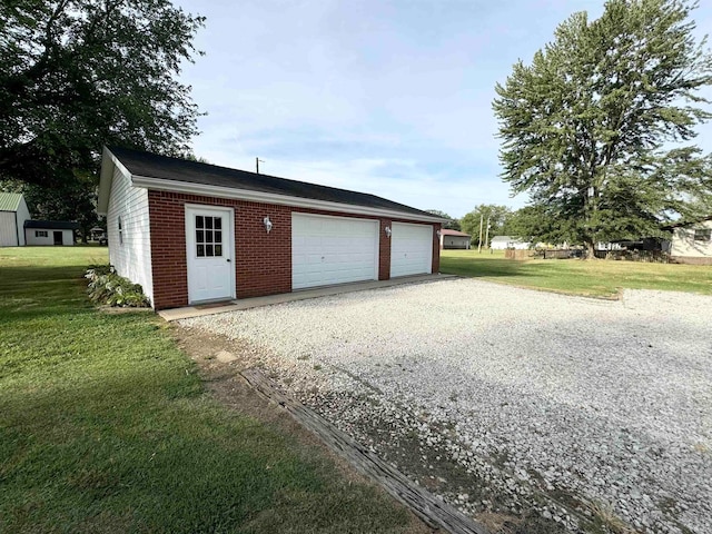 garage with a lawn