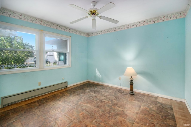 spare room with baseboard heating and ceiling fan