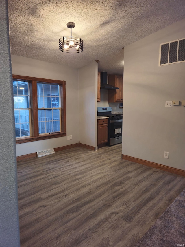 interior space featuring dark wood-type flooring and a textured ceiling