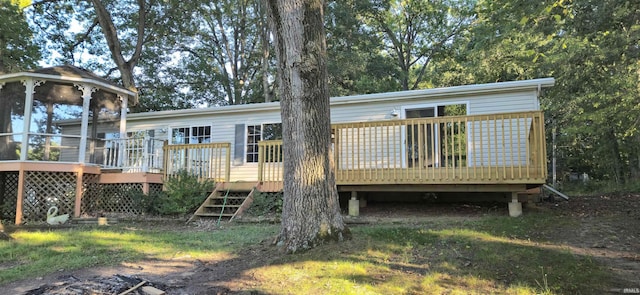 back of property featuring a wooden deck